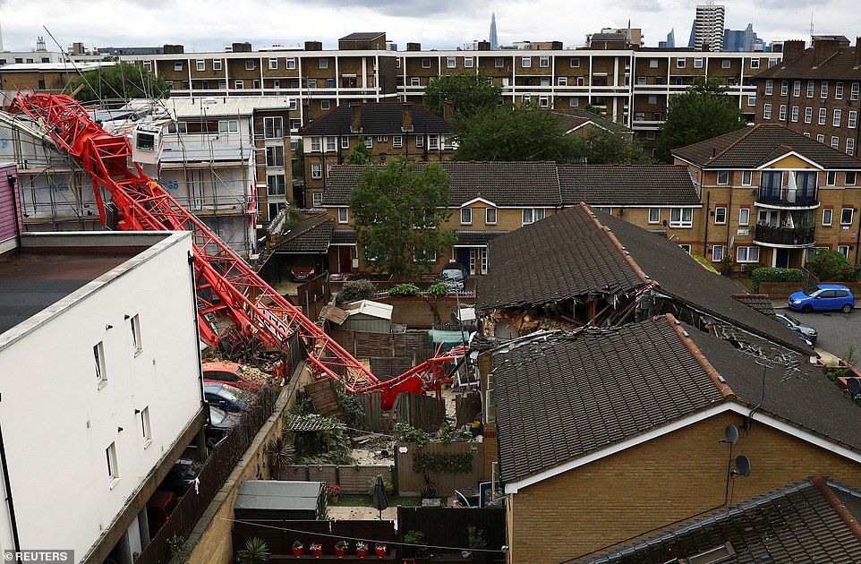 30538870-8502645-A_65_foot_high_crane_has_collapsed_in_east_London_destroying_two-a-1_1594226221807.jpg