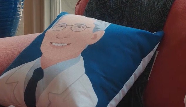 At times in the PBS documentary, set to air on Tuesday night, Dr Fauci appears to relish the media attention he gets. He has keepsakes around his home office like this novelty throw pillow likely gifted to him by a fan