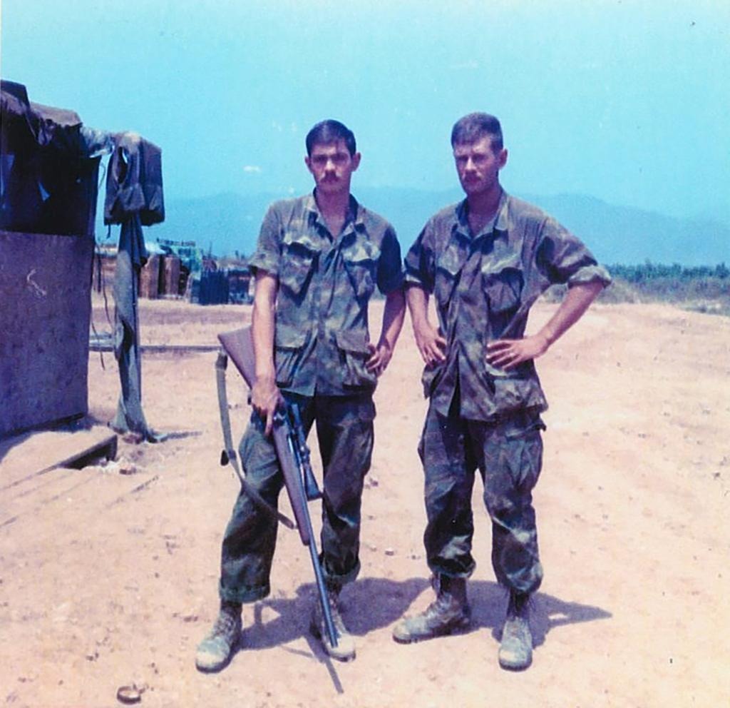 Mawhinney in Vietnam with one of his spotters who assisted him on identifying targets during the war.