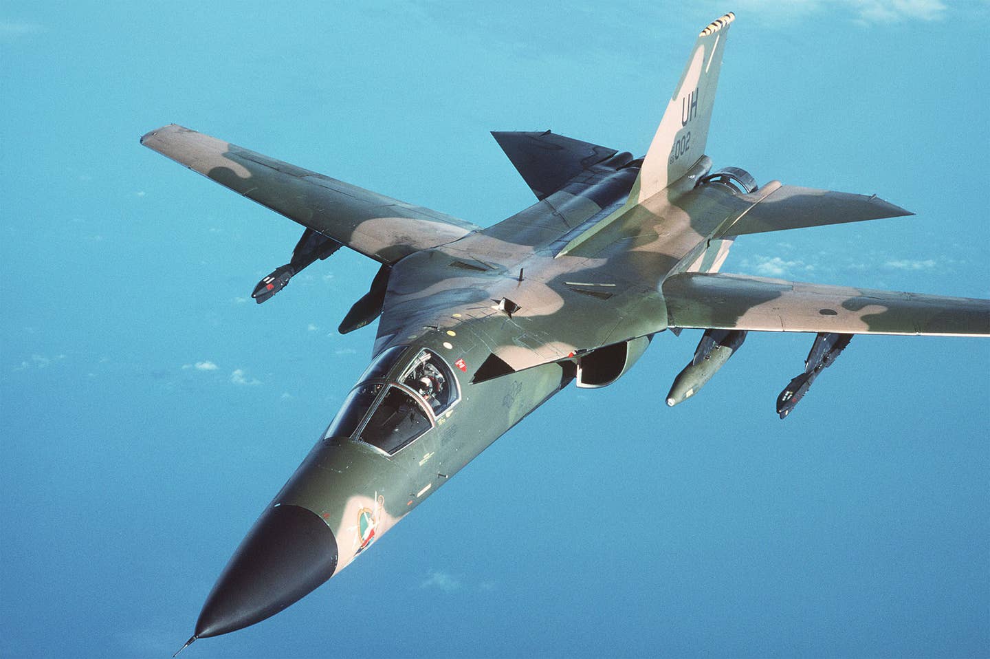 An air-to-air view of an F-111E from RAF Upper Heyford during a refueling mission over the North Sea. <em>U.S. Air Force</em>