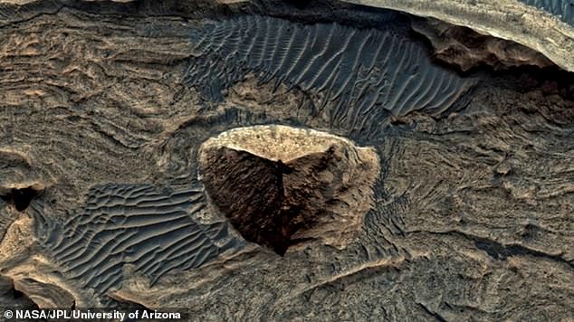 A mysterious pyramid-like structure spotted on Mars has sparked theories that an ancient civilization such as ours could have once existed on the red planet