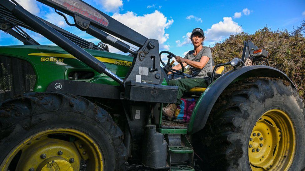 Aida drives a tractor in her village of Covas do Barroso