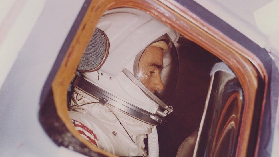 Astronaut Walter Cunningham seen through the window of the Spacecraft 012 Command Module during an altitude chamber test in the Manned Spacecraft Operations Building, Merritt Island, Kennedy Space Center, Florida, 30th December 1966.