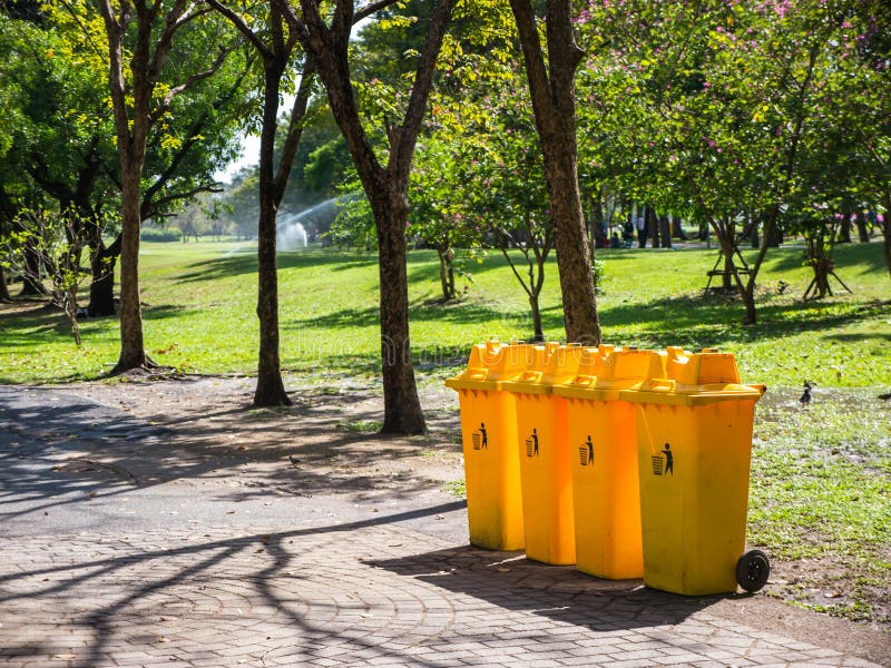 yellow-bins-recycle-public-park-72428077.jpg
